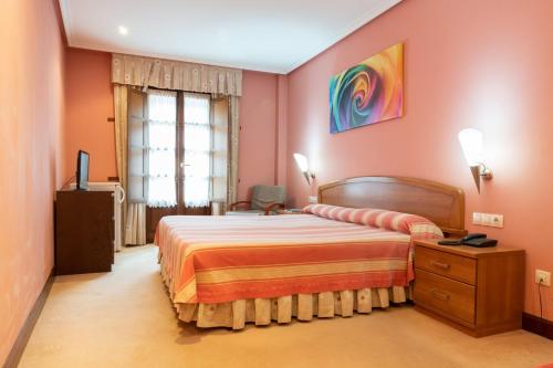 Katil atau katil-katil dalam bilik di Gran Hotel Rural Cela