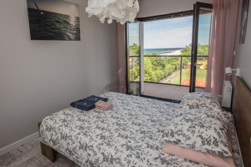 Postel nebo postele na pokoji v ubytování Apartament MORSKI WIDOK GARDENIA Dziwnów