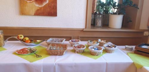 a table with baskets of fruit on top of it at Gross Bultener Hof in Peine