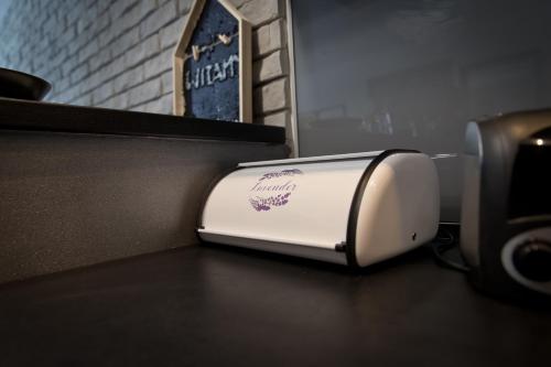 a white toaster sitting on top of a counter at Apartament Asia in Nysa