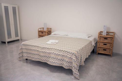Katil atau katil-katil dalam bilik di B&B Casa dei Nonni