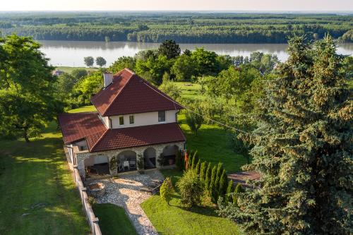 an aerial view of a house with a roof at Danubio Residence in Aljmaš