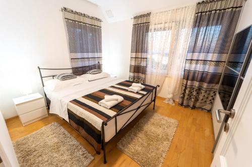 Giường trong phòng chung tại Danubio Residence