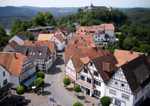 an aerial view of a town with buildings at Ringhotel Roggenland in Waldeck