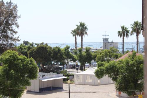 a view of a city with palm trees and the ocean at Aqua Ria Boutique Hotel in Faro
