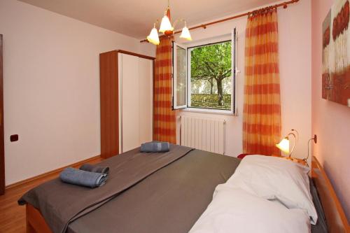 Postel nebo postele na pokoji v ubytování Apartments Alex