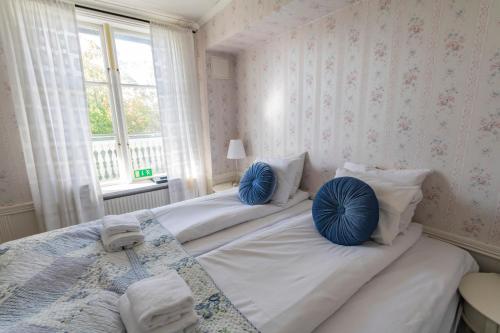 Ένα ή περισσότερα κρεβάτια σε δωμάτιο στο Hotel Pensionat Granparken