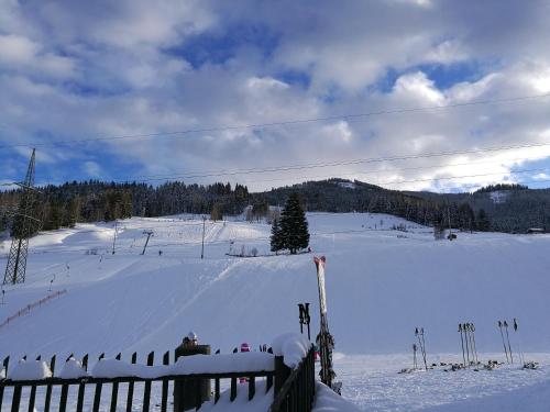 a snow covered slope with people on a ski lift at Gasthof Oberwirt in Lend