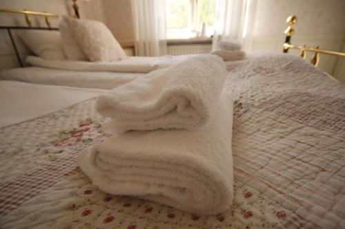Ένα ή περισσότερα κρεβάτια σε δωμάτιο στο Hotel Pensionat Granparken
