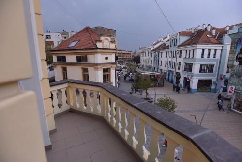 a view of a city from a balcony of a building at Hotel Beograd in Čačak