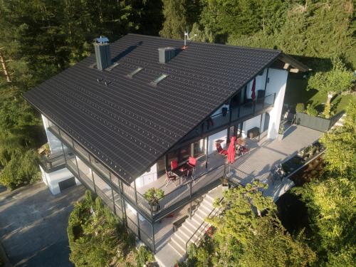 an overhead view of a house with a roof at Alpen Air exklusive Apartments in Bad Reichenhall