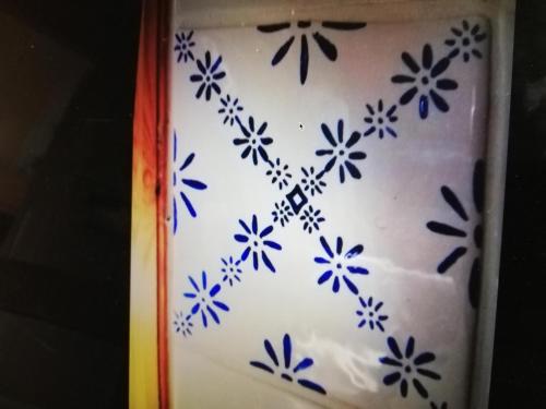 a cake with blue and white flowers on it at Lilla Lilo Gården in Östersund