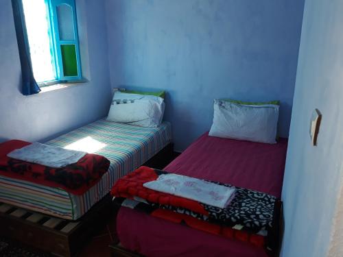 Cama o camas de una habitación en Dar Mdaqa