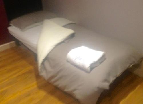 Ένα ή περισσότερα κρεβάτια σε δωμάτιο στο The Anfield Apartment