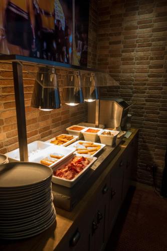 a buffet with many trays of food on a counter at The Kings Cross Hotel in Blackpool