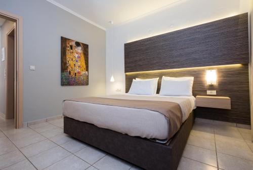 a bedroom with a large bed in a room at Sunny Bay Hotel in Kissamos