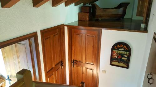 a room with a wooden cabinet and a door at Les Forques de'n Pep in Toses