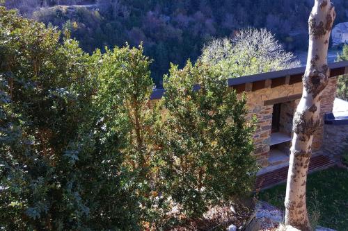 a building with trees in front of it at Les Forques de'n Pep in Toses