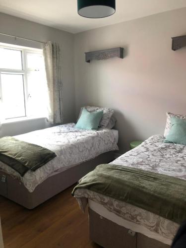 Ένα ή περισσότερα κρεβάτια σε δωμάτιο στο Castle View