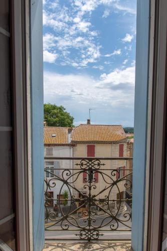 a view of a building from a window at Entre Midi - Maison d'Hôtes - B&B in Capestang