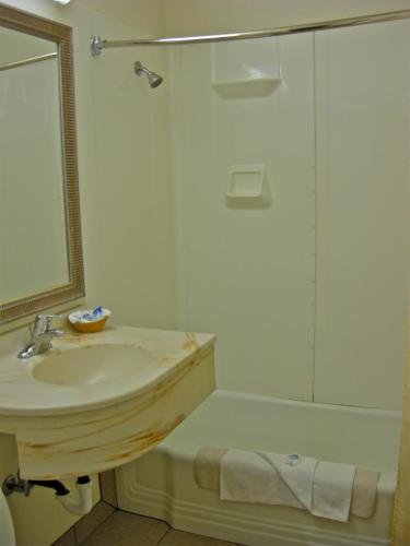 a bathroom with a sink and a shower at Americas Best Value Inn - Pendleton in Pendleton