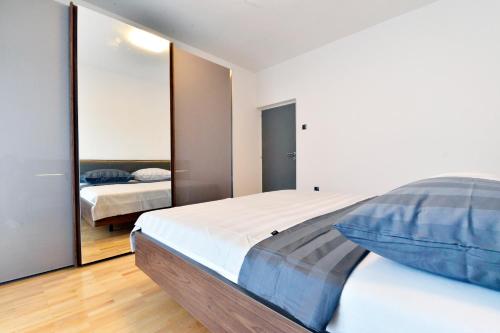 Posteľ alebo postele v izbe v ubytovaní Apartman Meri Pula