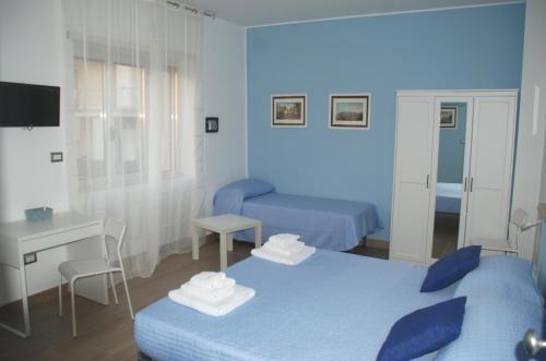 Posteľ alebo postele v izbe v ubytovaní Binario 2