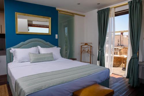Posteľ alebo postele v izbe v ubytovaní Acropolis Eye Loft