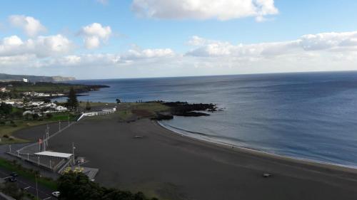 an aerial view of a beach and the ocean at Lila Ocean View Apartment in Ponta Delgada