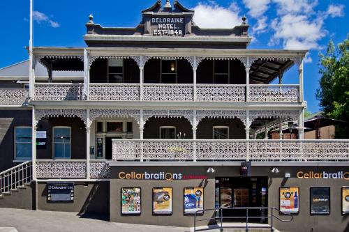 a building with a balcony on top of it at Deloraine Hotel in Deloraine