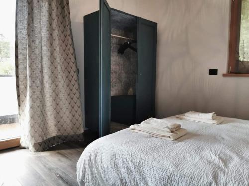 Postel nebo postele na pokoji v ubytování Appartamenti e B&B Casa Ester