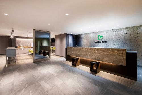 a lobby of a hotel with a reception desk at karaksa hotel TOKYO STATION in Tokyo