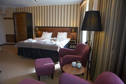 Postel nebo postele na pokoji v ubytování Home Hotel Slottsparken