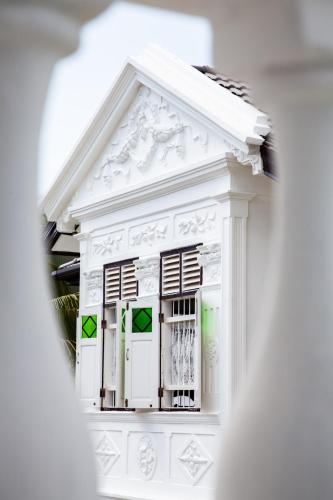a model of a white house with a window at Sound Gallery House - SHA Plus in Phuket Town