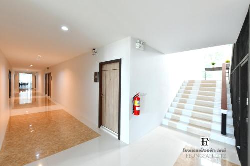 a hallway of a house with a staircase at Feungfah Litz in Phetchabun