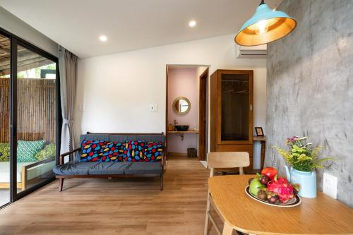 a living room with a couch and a table at Mimi House in Hoi An
