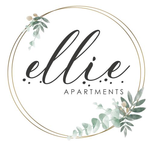 a watercolor floral wreath with a gold circle frame and calligraphy la at Ellie Apartments Stalida in Stalida
