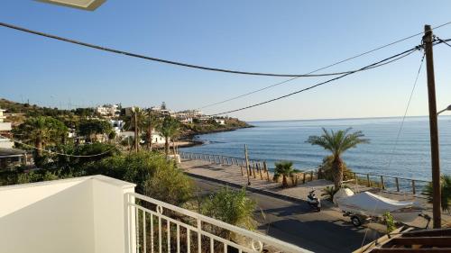a view of the ocean from a balcony at Ellie Apartments Stalida in Stalida