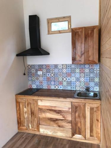 a kitchen with a sink and a counter top at Verin Tun in Dilijan