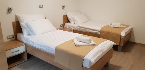 Postel nebo postele na pokoji v ubytování Apartments Vila Darja