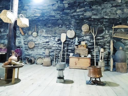 a room filled with lots of pots and utensils at Raul Lushnu Darbaz in Mestia