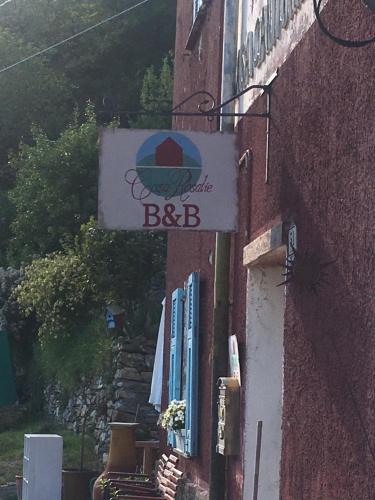 a sign on the side of a building at Casa Rosalie in Borgomaro