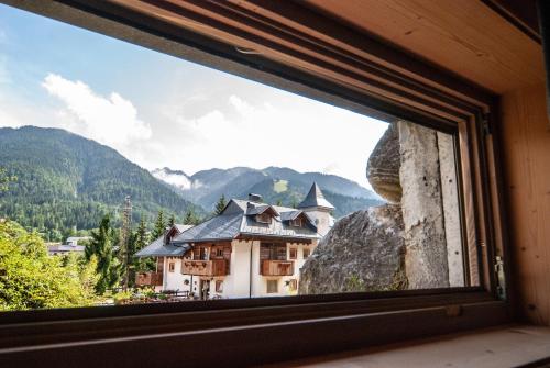 a window with a view of a mountain at Mountain Loft in Tarvisio