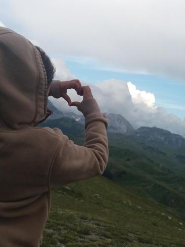 a person making a heart shape with their hands at Katun Ljeljenak in Pluzine