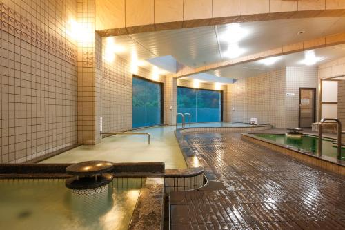 a large swimming pool with a swimming pool at Blue Villa Anabuki in Mima
