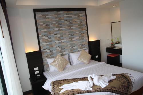 Una cama o camas en una habitación de Serene Residence