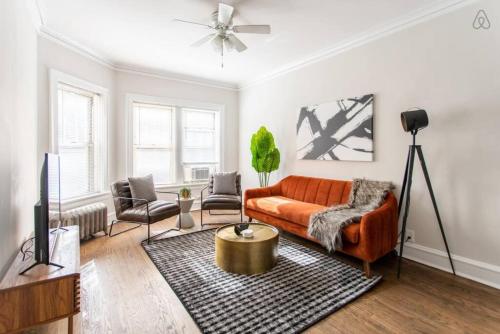 a living room with a couch and a table at Lively 2BR Apt in Lincoln Square - Eastwood 47-1 in Chicago