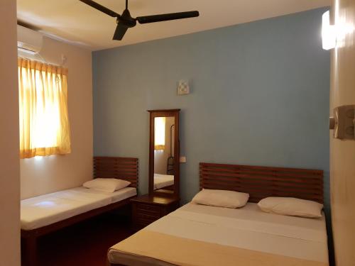 Ένα ή περισσότερα κρεβάτια σε δωμάτιο στο Shiva Rest Katharagama
