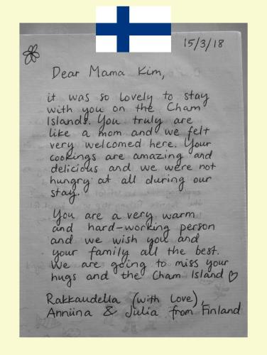 a letter written in black handwriting with a cross at Cham Island Smiles Homestay in Tân Hiệp