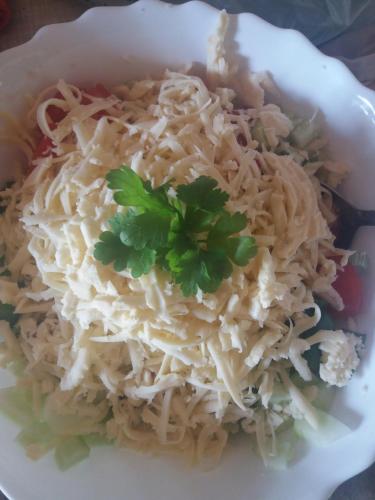 a bowl of noodles with a parsley on top at Katun Ljeljenak in Pluzine